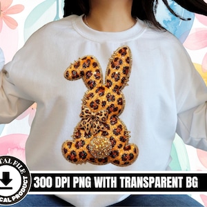 May include: White sweatshirt with a leopard print bunny design. The bunny has a bow and a glittery tail. The text "300 DPI PNG WITH TRANSPARENT BG" is printed at the bottom. This design is a digital file.