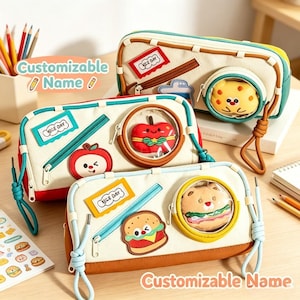 May include: Three rectangular canvas pencil cases featuring a circular clear window with a plush character inside, a side zipper pocket, and a rectangular patch with the text "NICE DAY". The cases are accented with colorful trim and zipper pulls.