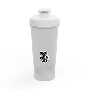 May include: A white plastic shaker bottle with a screw-on lid. The bottle has a sticker that says "Have a Good Day" in black, yellow, and white. The bottle is designed for mixing protein shakes or other beverages.