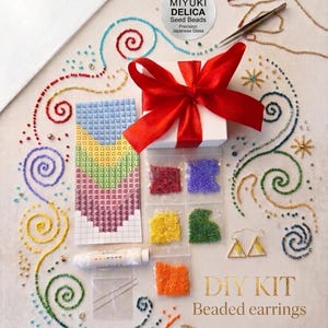 May include: A DIY kit for beaded earrings, featuring a variety of coloured seed beads, needles, thread, and a design chart. The image includes a white gift box with a red ribbon and the text "DIY KIT Beaded earrings".