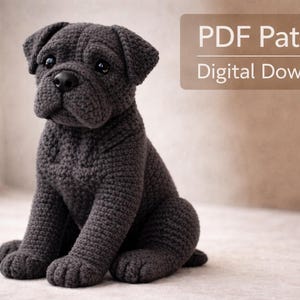 May include: A crocheted dark gray dog figurine in a seated position. The dog has a detailed texture, with visible stitches and a realistic appearance. The image includes text that reads "PDF Pattern Digital Download".