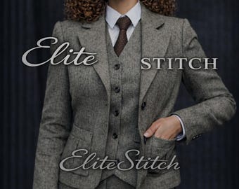May include: A three-piece suit in a grey tweed fabric featuring a blazer, a button-up vest, and trousers. The ensemble includes a white collared shirt and a brown polka-dot tie. The text Elite Stitch is visible across the center of the image.