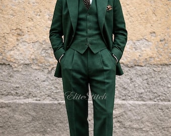 May include: A three-piece, dark green suit with a matching vest, jacket, and trousers. The suit is worn with a white dress shirt and a patterned tie. The image includes the text "Elite Stitch".