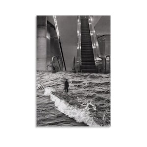 May include: Black and white art print depicting a person standing in floodwaters inside a building. An escalator and architectural elements are visible in the background. The print has a surreal, dreamlike quality.