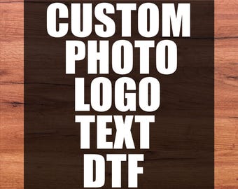 May include: A rectangular graphic featuring the white text DTF TRANSFER at the top and READY FOR PRESS at the bottom. The center contains the white words CUSTOM PHOTO LOGO TEXT DTF stacked vertically against a solid black square background.