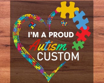 May include: A colorful heart-shaped design with puzzle pieces, the words "I'M A PROUD Autism CUSTOM" and "DTF TRANSFER READY FOR PRESS" on a wood grain background. The design features a variety of colors.