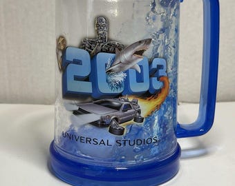 Universal Studios 2003 souvenir insulated blue clear plastic mug,  6" tall