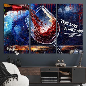 May include: A three-panel canvas art piece depicting red wine being poured into a glass. The background features a blue and gold abstract design with the text "TRUE LOVE ALWAYS WINS" in white.