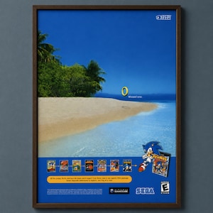 May include: A framed poster featuring a tropical beach scene with a golden ring and the text 'Missed one.' Below, the Sonic Gems Collection game case is shown with the character Sonic, alongside seven game icons, Sega and GameCube logos.