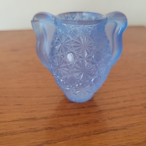 May include: A set of three ceramic mugs with a speckled, matte finish. Each mug features a different color: light blue, cream, and gray. The mugs have a simple, modern design, suitable for coffee or tea.