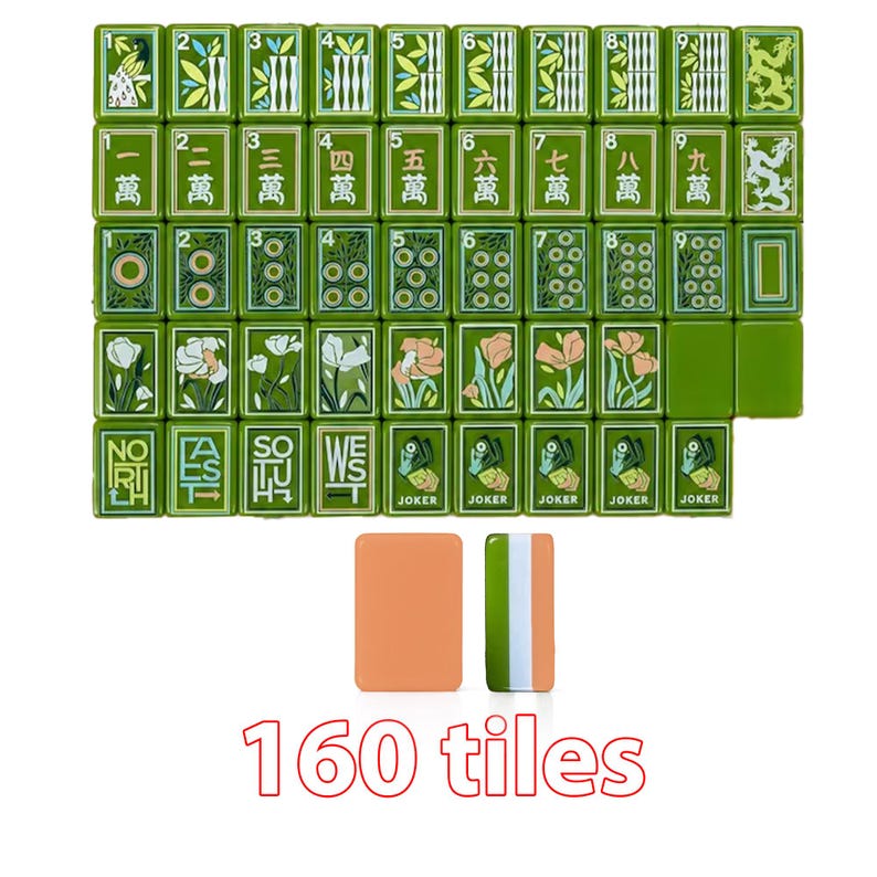 May include: A set of 160 green mahjong tiles featuring various illustrations including bamboo, Chinese characters, floral patterns, directional markers, and joker cards. The set includes two blank tiles, one solid orange and one green, white, and orange striped.