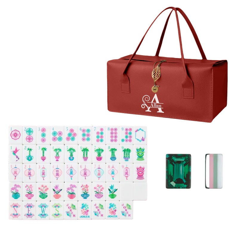 May include: A red rectangular carrying case with two handles, a gold leaf charm, and the white text "Allan" featuring a large letter A. Included are white mahjong tiles with colorful floral and character designs, plus one green gem-like tile.