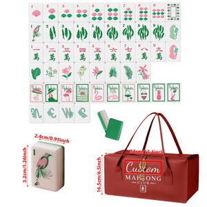 May include: A set of white mahjong tiles featuring pink and green botanical and animal illustrations, including joker tiles with various icons. A red carrying bag with the text Custom Mahjong Club is included, measuring 13.4 inches by 6.5 inches.