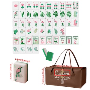 May include: A Mahjong set featuring white tiles with pink and green botanical, animal, and character illustrations, plus Joker tiles. Includes a brown carrying bag with the text Custom MAHJONG CLUB. Tiles measure 2.4cm by 3.2cm; bag measures 34cm by 16.5cm.
