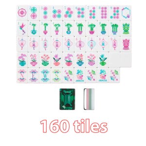 May include: A set of 160 white mahjong tiles featuring colorful illustrations of flowers, bamboo, lanterns, and text including NEWS and JOKER. The collection includes a solid emerald green rectangular tile and a striped white, pink, and green tile.