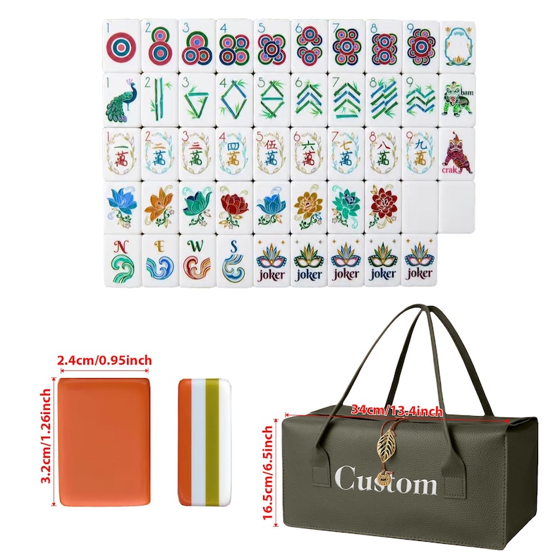 May include: A set of white mahjong tiles featuring colorful floral, numerical, and character designs, alongside an orange tile and a striped tile measuring 1.26 inches by 0.95 inches, and a dark green carrying bag labeled Custom measuring 13.4 by 6.5 inches.