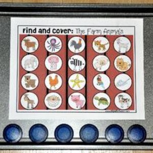 May include: A metal baking sheet with a printed sheet titled "Find and Cover: The Farm Animals." The sheet features illustrations of various farm animals in red and white circles. Below the sheet are ten blue magnetic discs.
