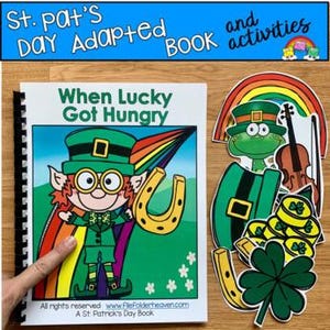 May include: A St. Patrick's Day adapted book titled "When Lucky Got Hungry" with a leprechaun illustration, a rainbow, and a horseshoe. Accompanying cutouts include a leprechaun, a rainbow, a violin, gold coins, and a four-leaf clover. The book and activities are on a wooden surface.