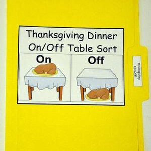 May include: A yellow file folder with a white label that reads "Thanksgiving Dinner On/Off Table Sort." The label shows two tables, one with a turkey on top and one with a turkey underneath. A tab on the right reads "Thanksgiving On/Off."