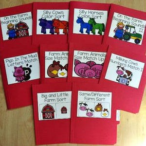May include: A collection of red file folders with white labels featuring farm animal illustrations and text. Titles include "On the Farm Beginning Sounds," "Silly Cows Color Sort," and "Pigs In The Mud Letters Match."