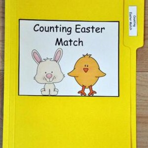 May include: A yellow file folder with a white label that reads "Counting Easter Match." The label features a cartoon bunny and chick. A smaller label on the tab reads "Counting Easter Match."