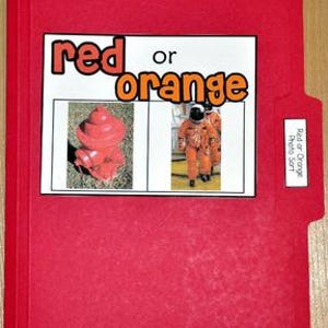 May include: A red file folder with a white label that reads "Red or Orange Photo Sort." The folder contains a white card with the words "red or orange" and images of a red fire hydrant and astronauts in orange suits.