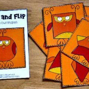 May include: A set of orange, square-shaped cards with owl illustrations, alongside a booklet titled "Match and Flip". The booklet and cards feature various owl shapes and the text "Match the Owl Shapes". The cards are connected with a metal ring.