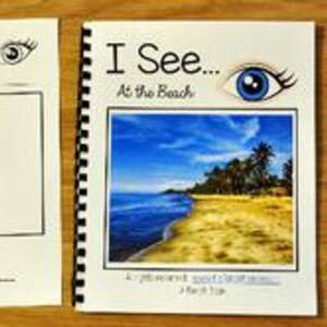 Puede incluir: Un libro encuadernado en espiral titulado "I See... At the Beach" con una escena de playa en la portada, una página en blanco y varias imágenes pequeñas con temática de playa. La portada presenta un gráfico de ojo.