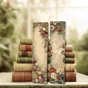 May include: Two floral bookmarks with a vintage aesthetic. The bookmarks feature a cream-colored background with a floral design in shades of red, pink, and white. The bookmarks are placed in front of a stack of old books.