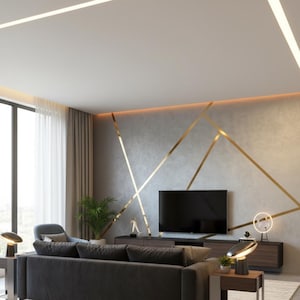 May include: A living room featuring a gray wall with gold geometric lines, a dark gray sofa, a dark wood media console with a flat screen television, two modern table lamps, a green potted plant, and recessed ceiling lighting strips.