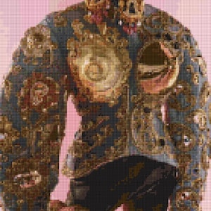 May include: A detailed image of a jacket with ornate gold and brown embroidery on a dark blue background. The jacket features large floral designs and intricate patterns. The background is a soft pink.