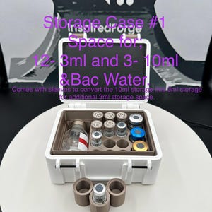 May include: A white rectangular storage case with a hinged lid containing a brown insert with circular slots for vials. The text reads: Storage Case #1, Space for 12- 3ml and 3- 10ml & Bac Water. Comes with sleeves to convert the 10ml storage into 3ml storage.