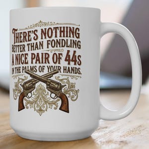 May include: A set of three ceramic mugs with a speckled, matte finish. The mugs are in shades of cream, light gray, and dark gray. Each mug has a simple, minimalist design, perfect for coffee or tea.