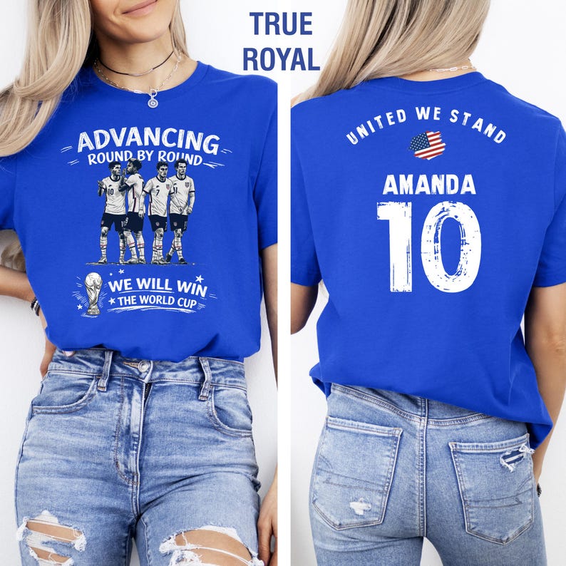 May include: Royal blue t-shirt with the text "ADVANCING ROUND BY ROUND" and "WE WILL WIN THE WORLD CUP". The back of the shirt has "UNITED WE STAND", the name "AMANDA", and the number "10".