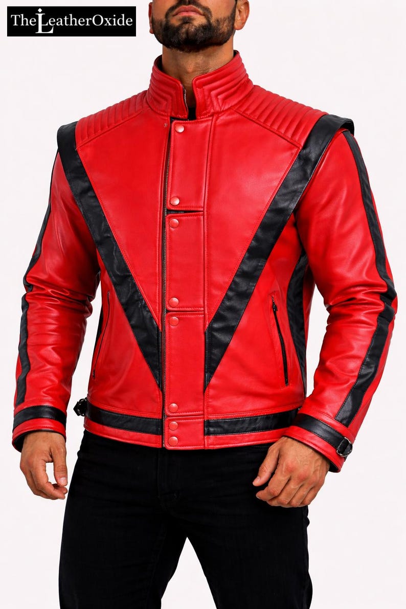 May include: A vibrant red leather jacket with black detailing. It has a stand-up collar, quilted shoulder panels, and a zip closure. Black stripes run across the chest and arms. The LeatherOxide logo is visible.