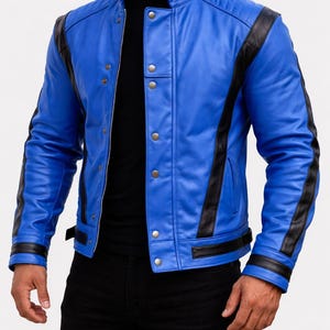 May include: A striking blue leather jacket with black detailing. The jacket has a stand-up collar, press stud fastenings, and black stripes on the sleeves and sides. The LeatherOxide logo is visible in the top left corner.
