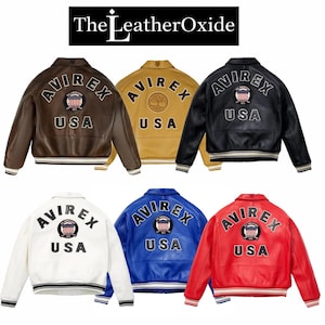 May include: Six leather bomber jackets in various colors: brown, gold, black, white, blue, and red. Each jacket features the "AVIREX USA" logo on the back and the "The Leather Oxide" logo at the top. The jackets have striped cuffs and waistbands.