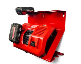 May include: Red metal wall mount with two Milwaukee batteries and a Milwaukee rapid charger. The charger has the text "Milwaukee" and "Rapid Charger" on it.
