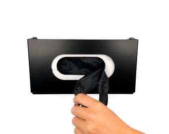 Puede incluir: Un dispensador de pared negro con una abertura blanca para dispensar guantes desechables negros.