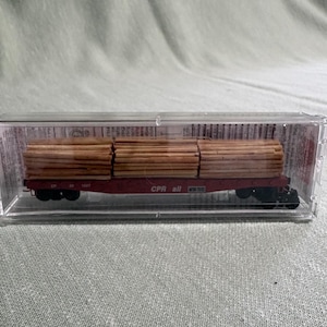 Micro Trains 045 00 280 flat car with lumber load.