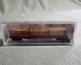 Micro Trains 045 00 280 flat car with lumber load.