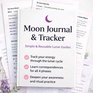 May include: A white Moon Journal & Tracker book with a purple crescent moon graphic. The cover text reads "Moon Journal & Tracker" and "Simple & Reusable Lunar Guides." The book promises to help track energy, learn correspondences, and deepen awareness.