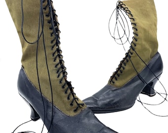 May include: A pair of black and green lace-up boots with a pointed toe and a small heel.