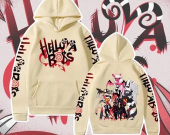 May include: Cream-colored hoodie featuring the text "Helluva Boss" in black and red on the front. The sleeves have additional text and the back displays a group of cartoon characters. A hooded sweatshirt.