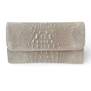 May include: A white ceramic mug with a black handle and the text "But First, Coffee" in a bold, black font. The mug is set against a blurred background, suggesting a cozy setting.