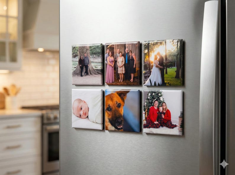May include: Six square canvas prints with family photos are displayed on a refrigerator. The images include a baby, a dog, a couple, a wedding, and a family portrait. The prints are arranged in two rows of three.
