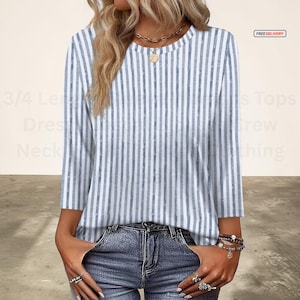 Blusa casual de mujer de manga 3/4, cuello redondo, corte holgado, a la moda.