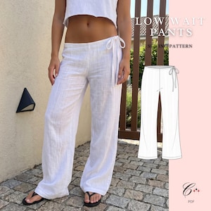 May include: White low-waist pants with a side tie closure and a textured fabric finish. The image includes a technical line drawing of the pants labeled LOW WAIT PANTS SEWING PATTERN and a small logo with the text PDF at the bottom right corner.