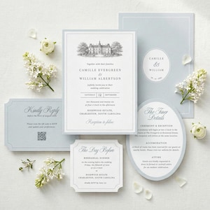 May include: A wedding invitation suite in light blue and white, featuring a main rectangular card with a black ink illustration of an estate, a matching RSVP card with a QR code, a rehearsal dinner card, and an oval-shaped details card.