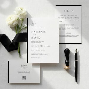 May include: A sophisticated wedding invitation set with white cards and black text, announcing Marianne and Bruno's wedding. A black wax seal, pen, and white flowers with a black ribbon are also present.